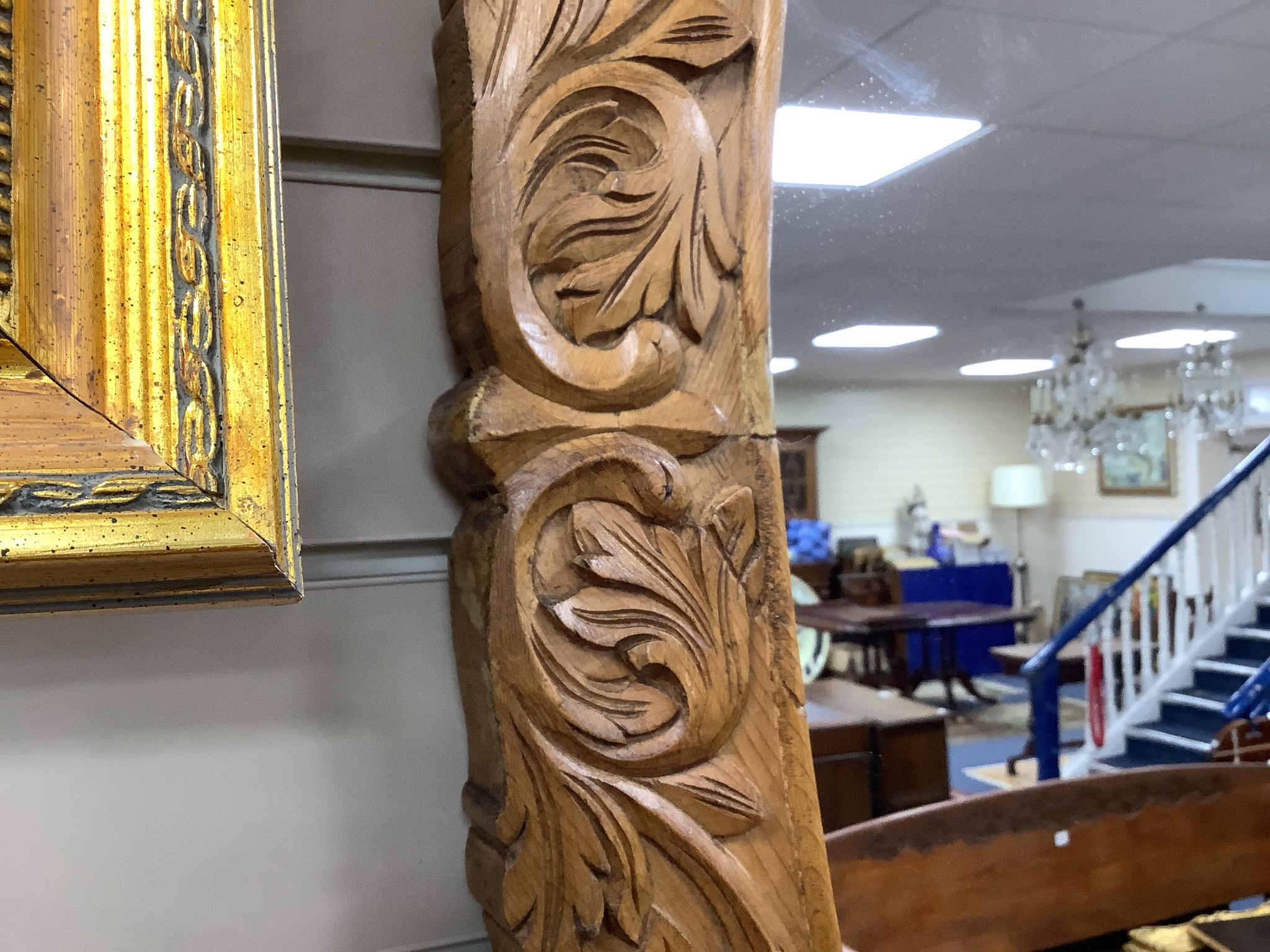 A carved oak oval framed wall mirror, width 70cm, height 109cm